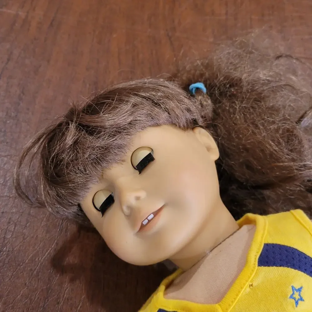 American Girl Doll Grey eyes light brown  hair.